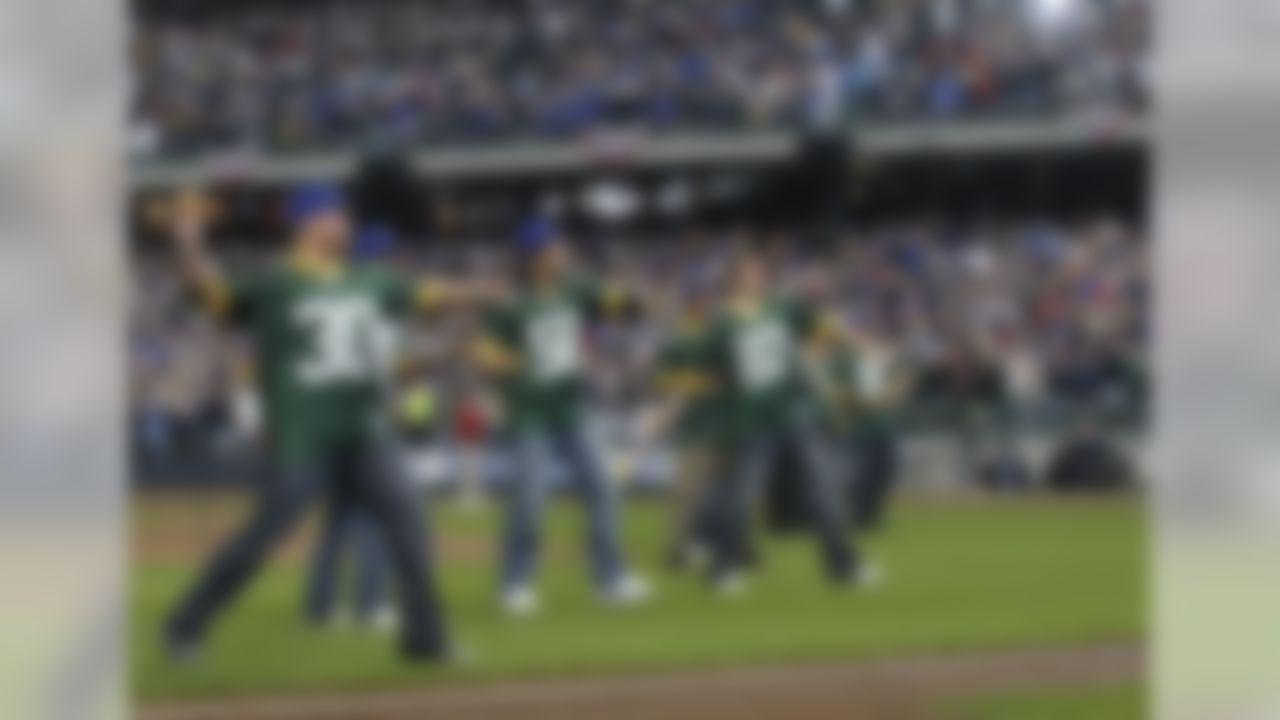 Players from the Super Bowl champion Green Bay Packers toss out first pitches before the Brewers/Braves game on April 4, 2011, in Milwaukee. (AP Photo/Jeffrey Phelps)