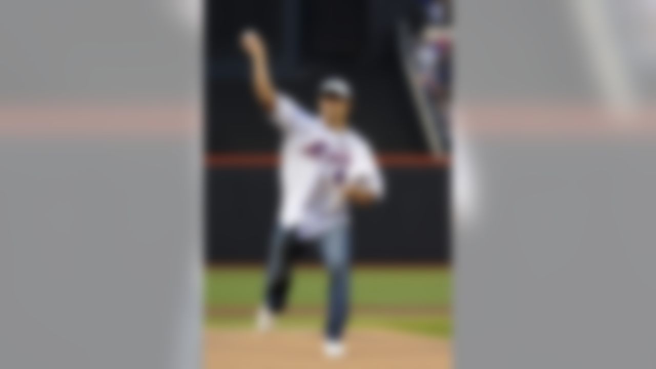 New York Jets quarterback Mark Sanchez tosses out the ceremonial first pitch before a baseball game between the Florida Marlins and the New York Mets on Monday, April 27, 2009, in New York. (AP Photo/John Dunn)