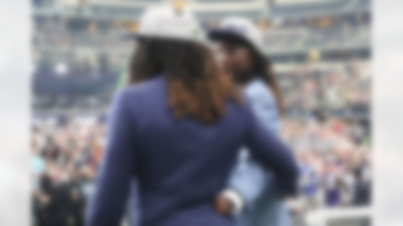 Shaquem Griffin, right, celebrates with his brother, Shaquill, on stage during the 2018 NFL Draft.
