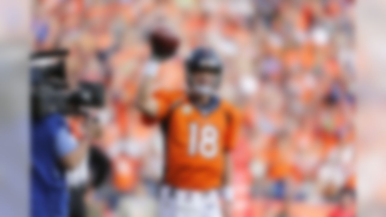 Denver Broncos quarterback Peyton Manning (18) celebrates after setting the all-time passing record of 71,839-yards during an NFL football game against the Kansas City Chiefs at Sports Authority Field at Mile High, Sunday, Nov. 15, 2015, in Denver, Colorado. (Ben Liebenberg/NFL)