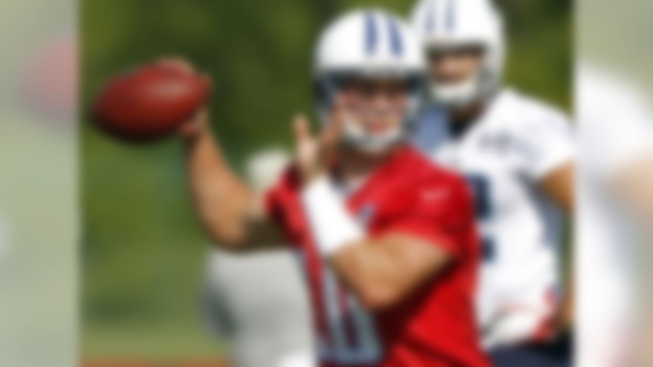 Tennessee Titan quarterback Jake Locker throws to a receiver during NFL football training camp on Saturday, July 28, 2012, Nashville, Tenn. (AP Photo/Wade Payne)