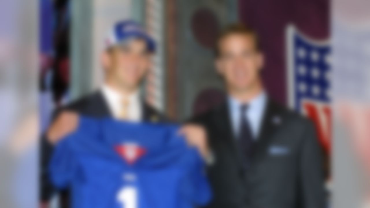 Eli Manning of the New York Giants with his brother Peyton Manning of the Indianapolis Colts at the 2004 NFL Draft in New York. (Cliff Welch/Associated Press)