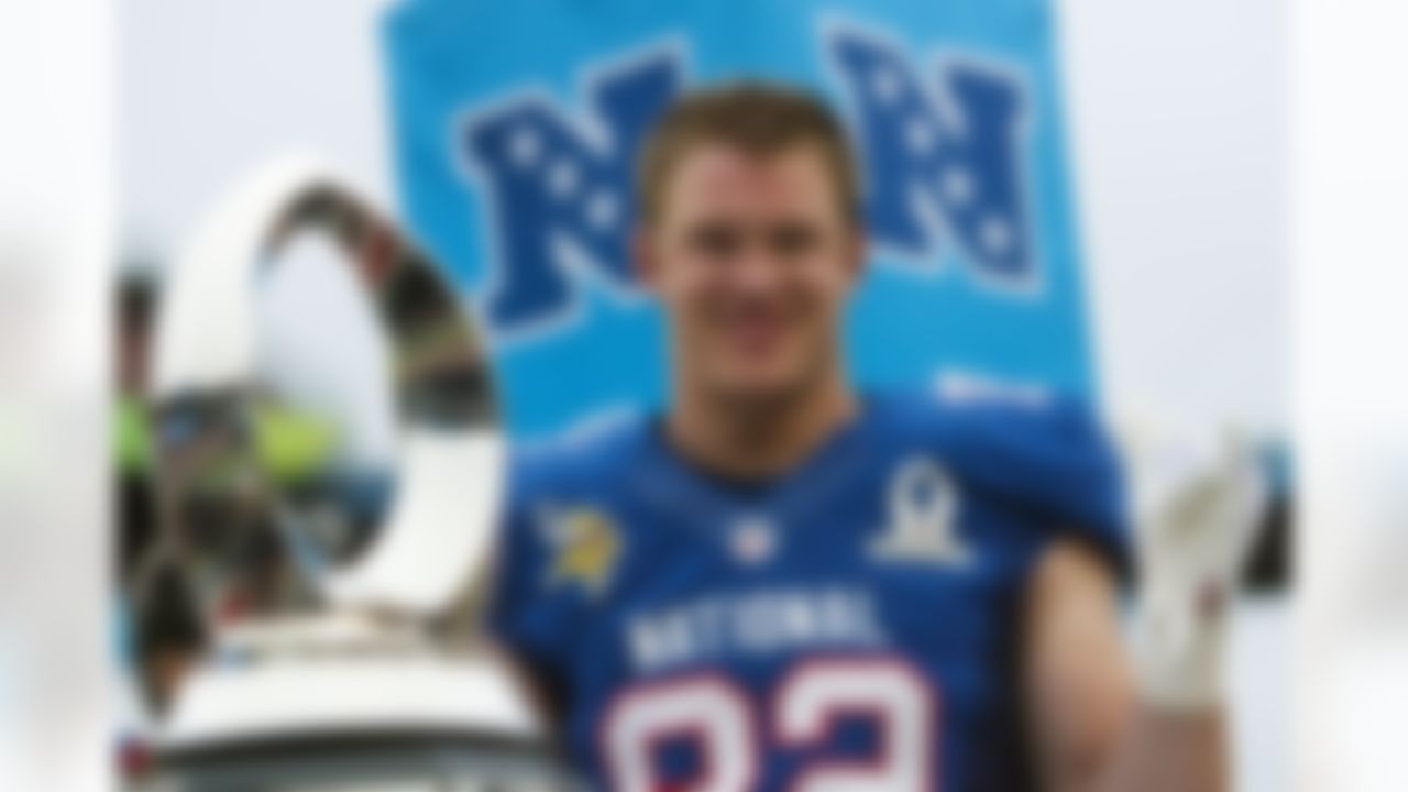 Minnesota Vikings tight end Kyle Rudolph (82) of the NFC flashes the shaka sign as he poses with the MVP trophy following the NFL football Pro Bowl game against the AFC in Honolulu, Sunday, Jan. 27, 2013. Rudolph had 122 yards and a touchdown as the NFC won 62-35. (AP Photo/Marco Garcia)