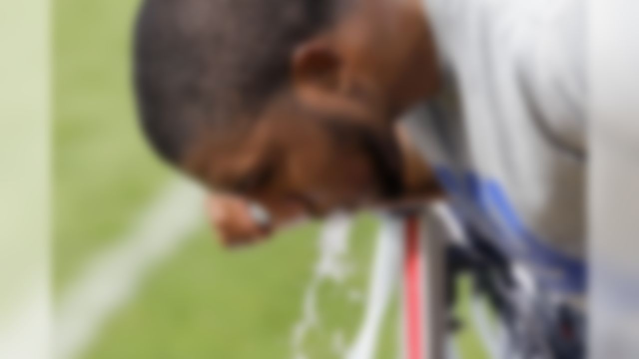 New York Giants cornerback Jayron Hosley takes a drink after running on the field during a physical evaluation drill on opening day of NFL football training camp in Albany, N.Y., Thursday, July 26, 2012. (AP Photo/Kathy Willens)