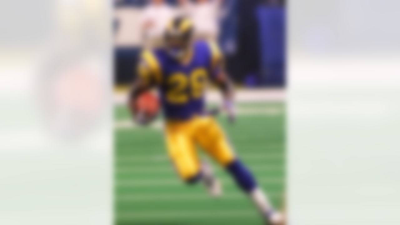 St. Louis Rams star running back Marshall Faulk rushes in the first half of the NFC divisional playoff game against the Minnesota Vikings on Sunday, Jan.16, 2000, in St. Louis. The Rams meet the Tennessee Titans in the Super Bowl in Atlanta Sunday, January 30. (AP Photo/Tom Gannam)