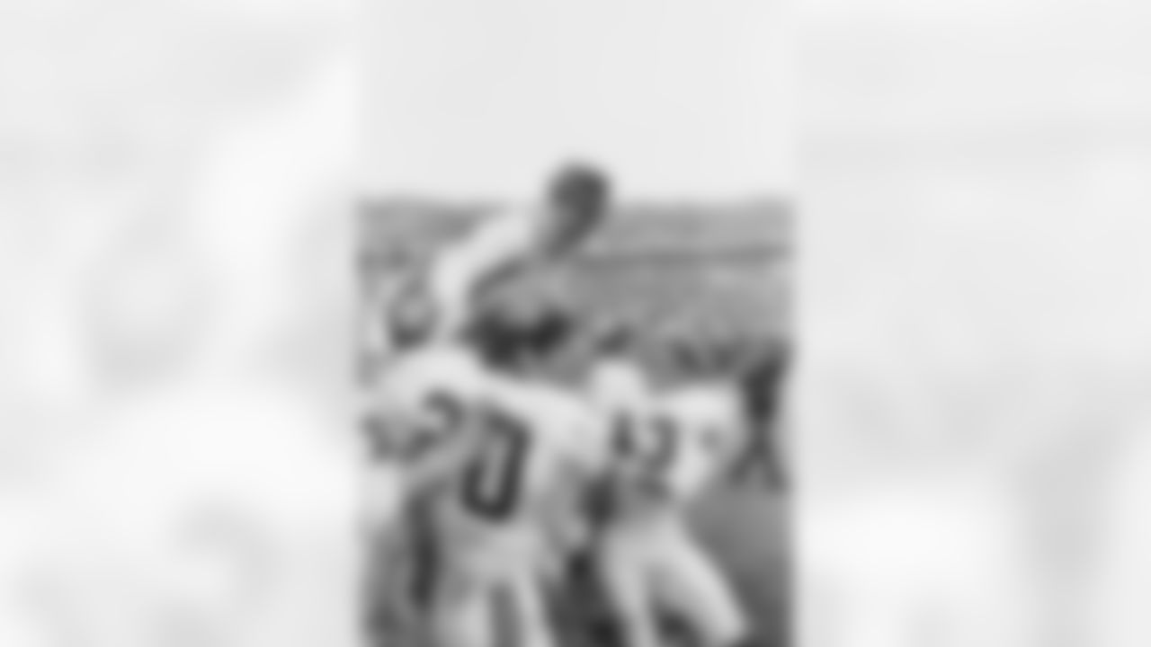 Alabama coach Paul "Bear" Bryant gets a ride on the shoulders of his team after Alabama beat Nebraska, 34-7 in the Sugar Bowl in New Orleans on Jan. 1, 1966. Halfback Eddie Propst (43) rushes up to congratulate his coach as others join in the celebration. In the foreground is Donnie Johnson (20). (Associated Press)