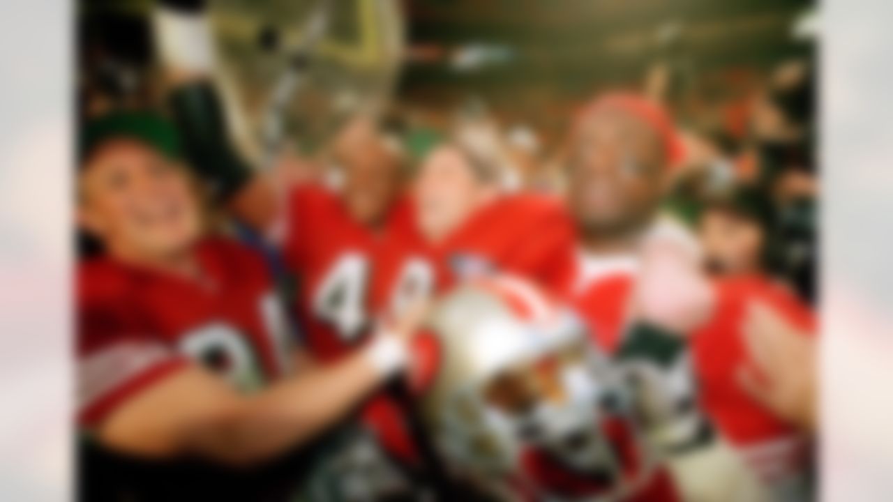 San Francisco 49ers players, from left, Brent Jones, William Floyd, Steve Young and Merton Hanks, celebrate after defeating the San Diego Chargers in Super Bowl XXIX at Miami's Joe Robbie Stadium on Jan. 29, 1995. (AP Photo/Susan Walsh)