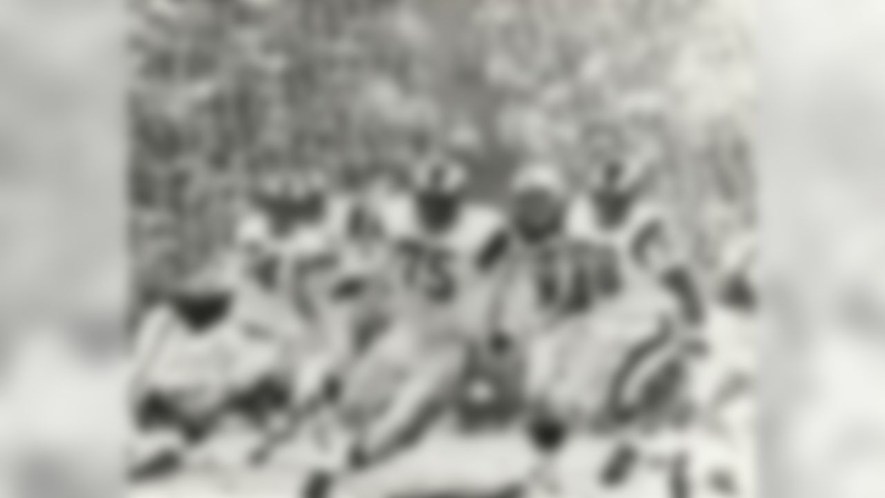 Los Angeles Rams " Fearsome Foursome " defensive ends David " Deacon " Jones and Lamar Lundy, defensive tackles Merlin Olsen and Roger Brown pursue in a 34 to 10 win over the Baltimore Colts on December 17, 1967 at Memorial Coliseum in Los Angeles, California. (National Football League)