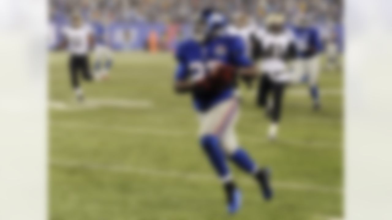 New York Giants running back David Wilson (22) runs for a 52-yard touchdown against the New Orleans Saints during the second half of an NFL football game, Sunday, Dec. 9, 2012, in East Rutherford, N.J. (AP Photo/Bill Kostroun)