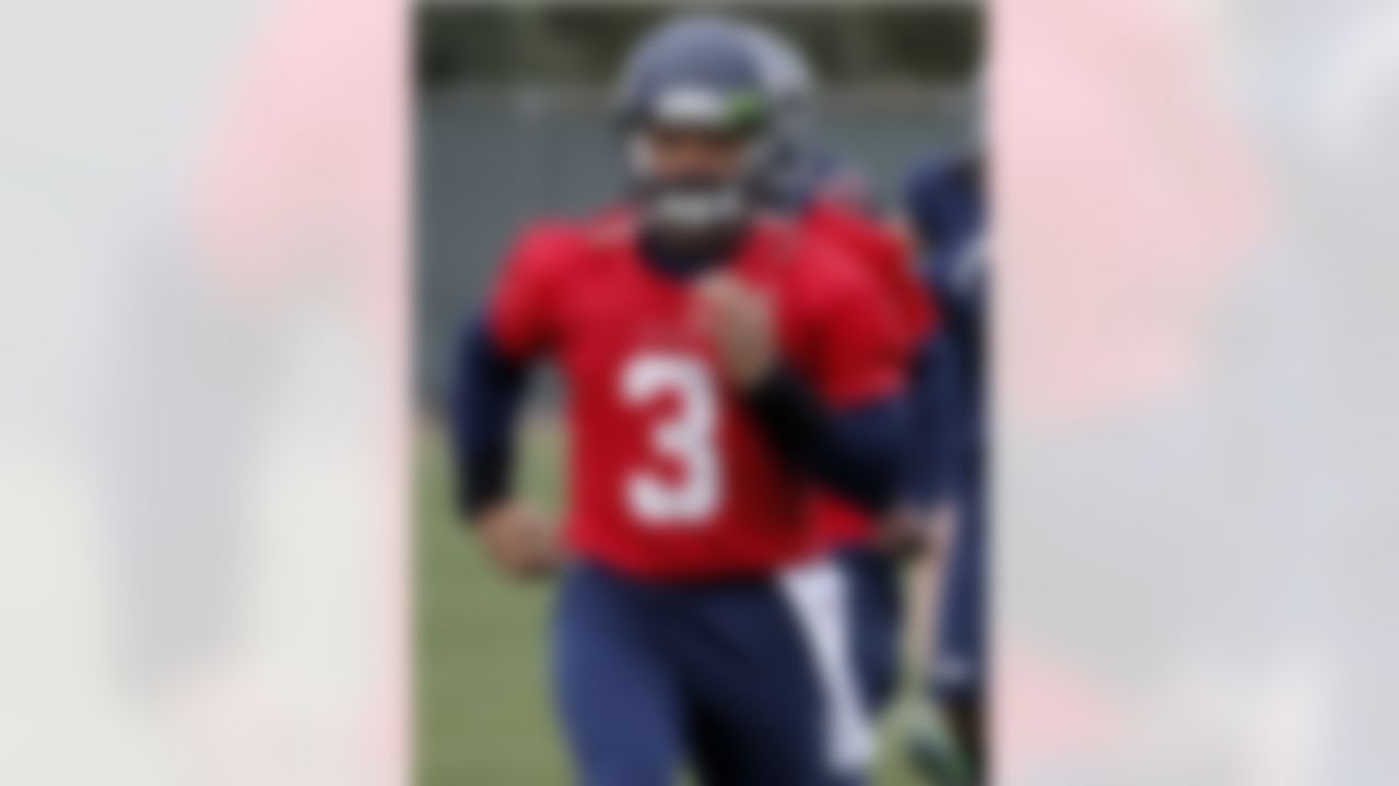 Seattle Seahawks' quarterback Russell Wilson runs drills during a team practice for NFL Super Bowl XLIX football game, Wednesday, Jan. 28, 2015, in Tempe, Ariz. The Seahawks play the New England Patriots in Super Bowl XLIX on Sunday, Feb. 1, 2015. (AP Photo/Matt York)