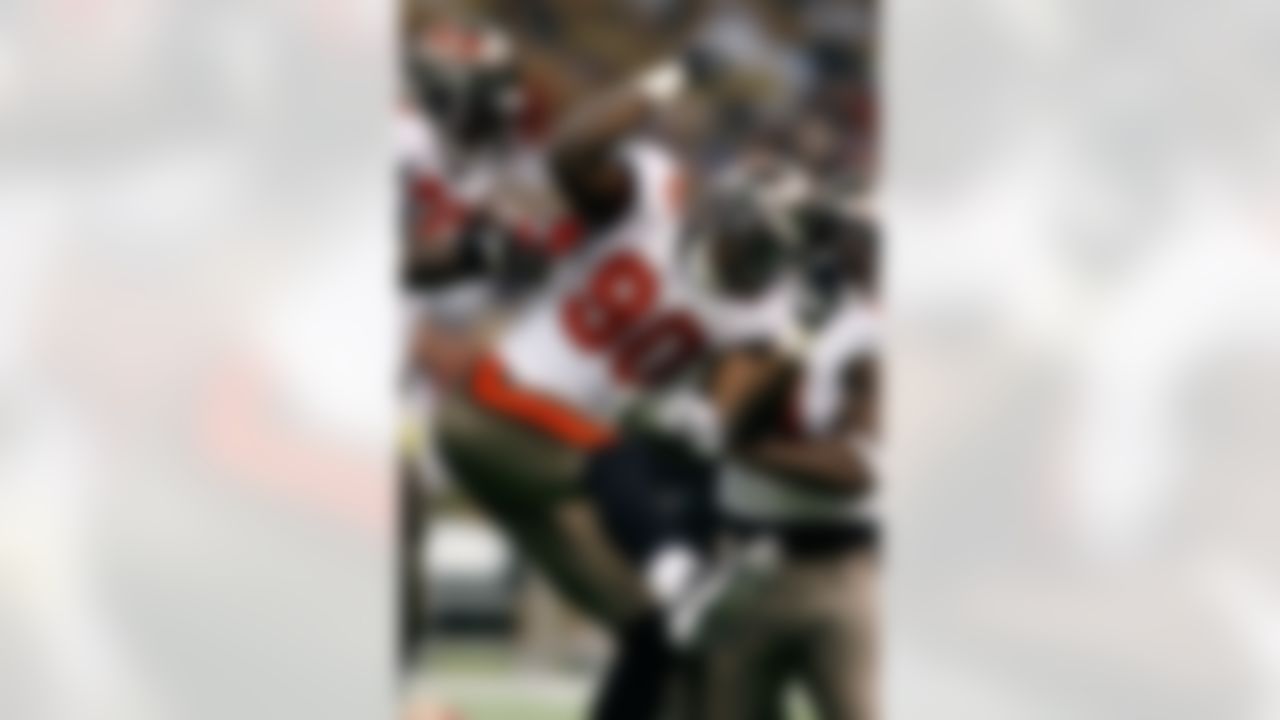 NEW ORLEANS - DECEMBER 02: Gaines Adams #90 of the Tampa Bay Buccaneers celebrates after sacking quarterback Drew Brees #9 of the New Orleans Saints on December 2, 2007 at the Louisiana Superdome in New Orleans, Louisiana. The Buccaneers defeated the Saints 27-23. (Photo by Chris Graythen/Getty Images)