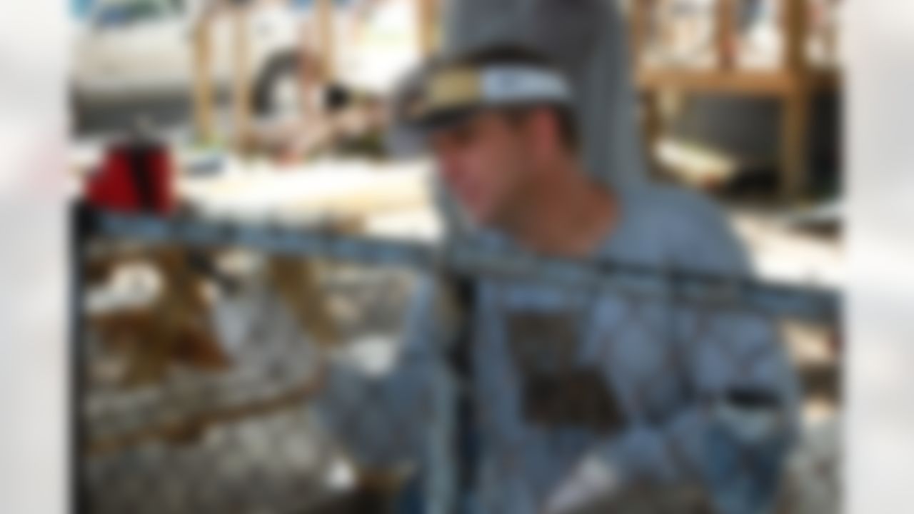 Sean Payton, head coach of the New Orleans Saints helps to rebuild a home ravaged by Hurricane Katrina in New Orleans, Louisiana on June 10, 2008.