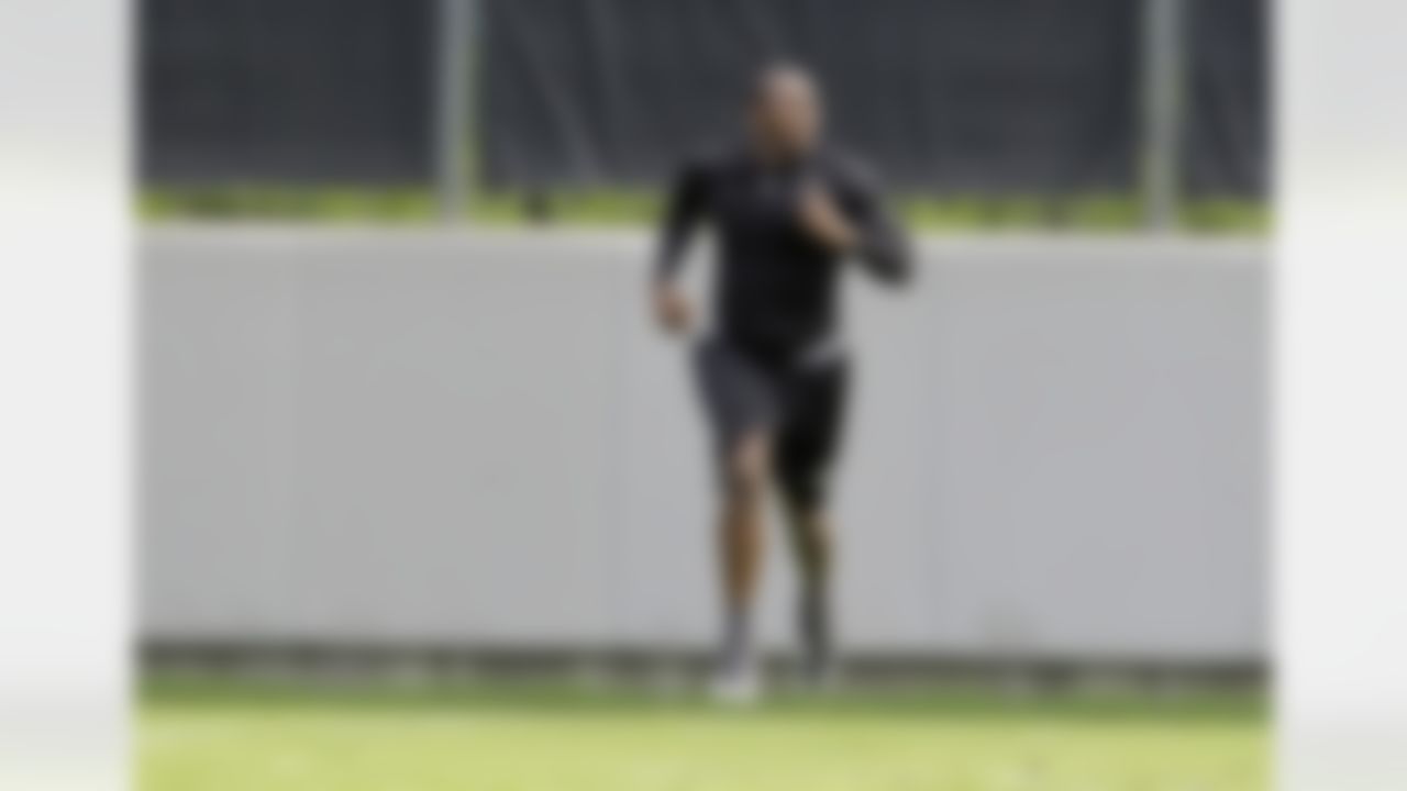 Carolina Panthers' Thomas Davis runs sprints during a voluntary football workout session in Charlotte, N.C., Wednesday, June 2, 2010. (AP Photo/Chuck Burton)