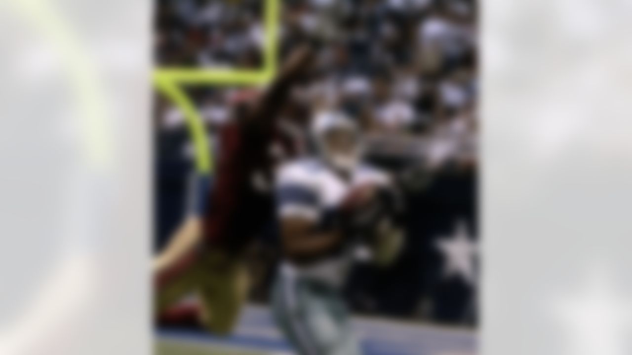 Dallas Cowboys wide receiver Terry Glenn (83) pulls in 52-yard pass against San Francisco 49ers safety Tony Parish (33) during the second quarter of their pre-season football game in Irving, Texas, Saturday, Aug. 26, 2006. (L.M. Otero/Associated Press)