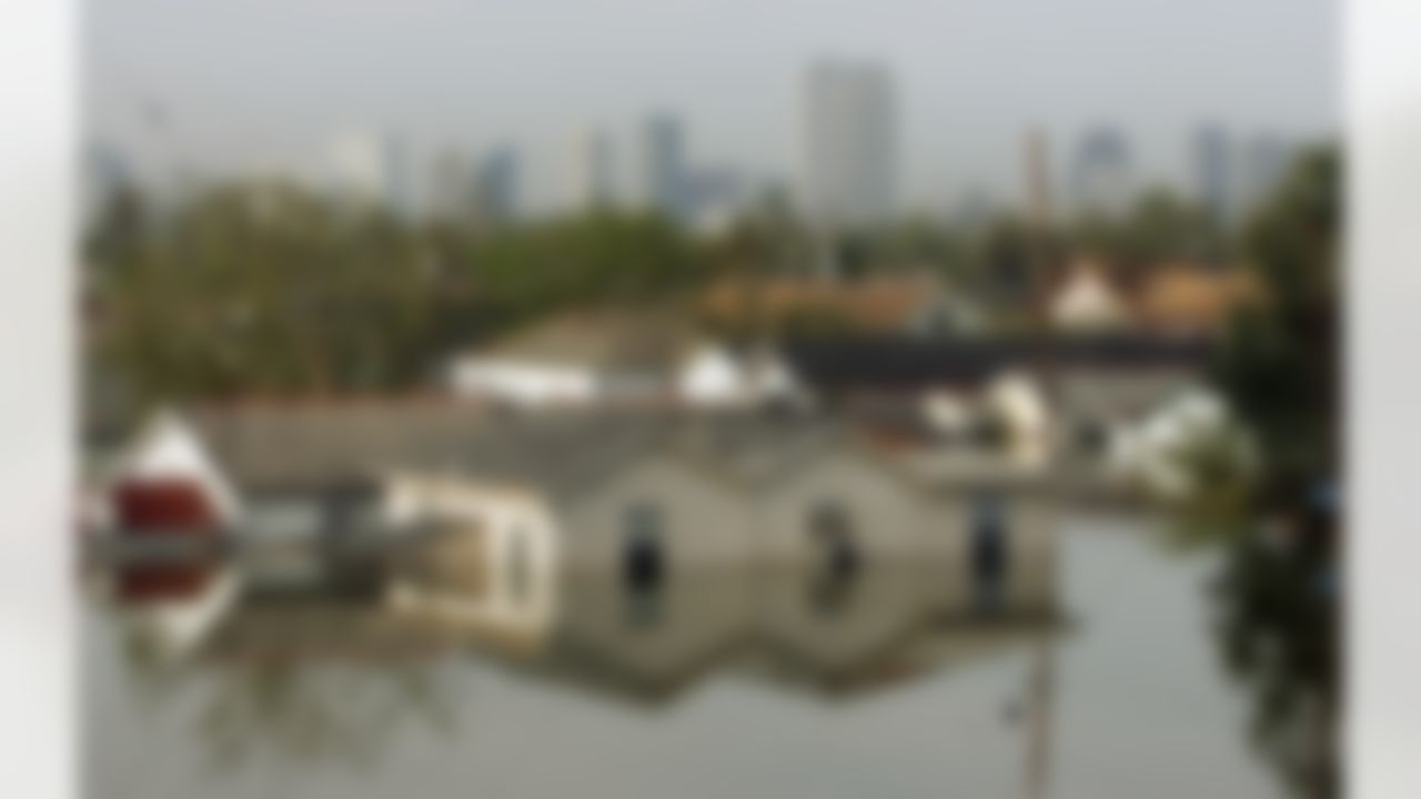 Houses in New Orleans' Eighth Ward are surrounded by water on Tuesday, Aug. 30, 2005. (AP Photo/Dave Martin)