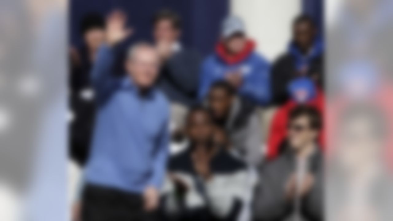 New York Giants quarterback Eli Manning, right, and defensive end Justin Tuck, center, applaud as head coach Tom Coughlin is introduced to the crowd during a ceremony for the NFL football Super Bowl XLVI champions at City Hall in New York, Tuesday, Feb. 7, 2012. (AP Photo/Kathy Willens)