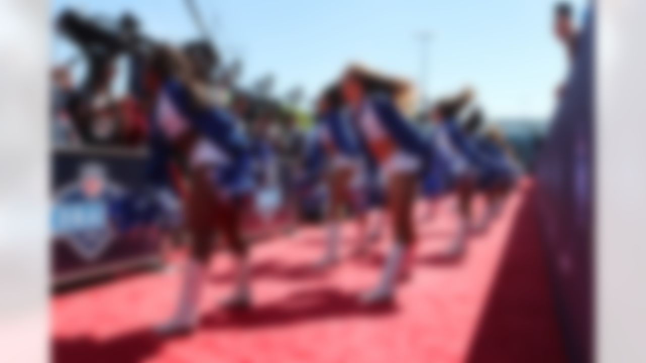 Dallas Cowboys cheerleaders perform on the red carpet.