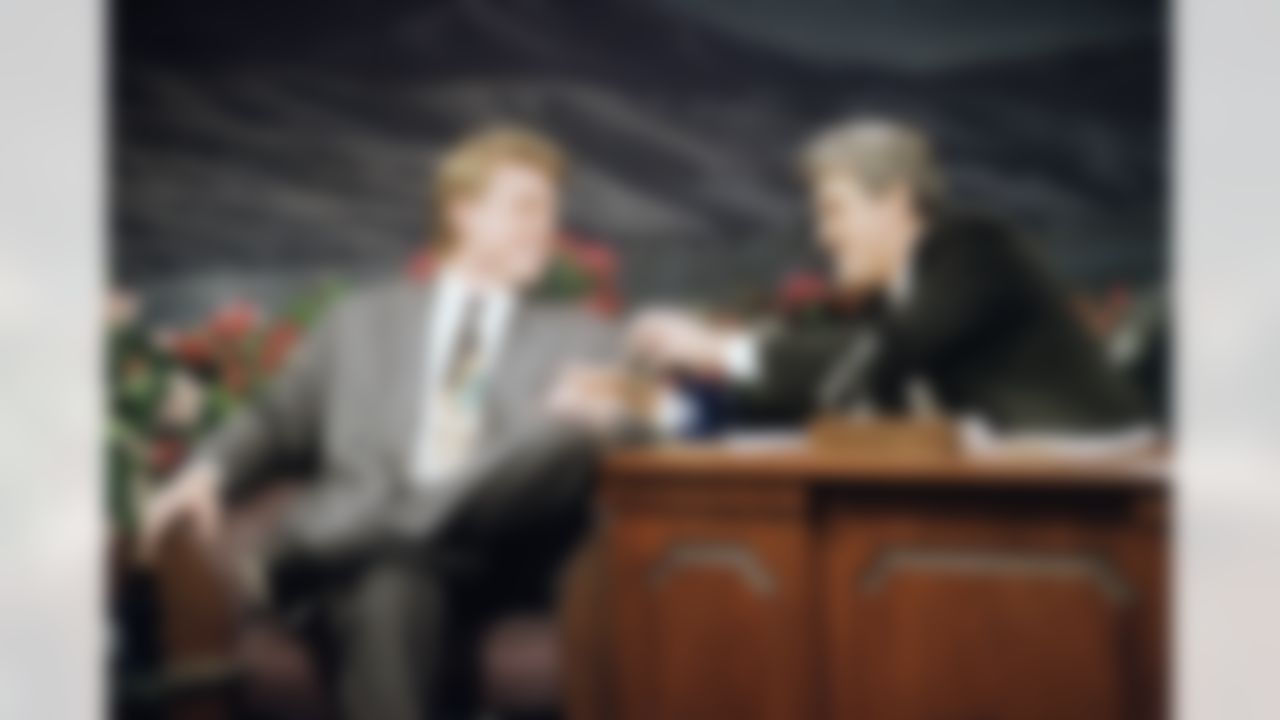 Dallas Cowboys' quarterback Troy Aikman, left, the Most Valuable Player of Super Bowl XXVII, shares a laugh with "The Tonight Show" host Jay Leno during the taping of the show in Burbank, Calif., Feb. 1, 1993. (AP Photo/Kevork Djansezian)