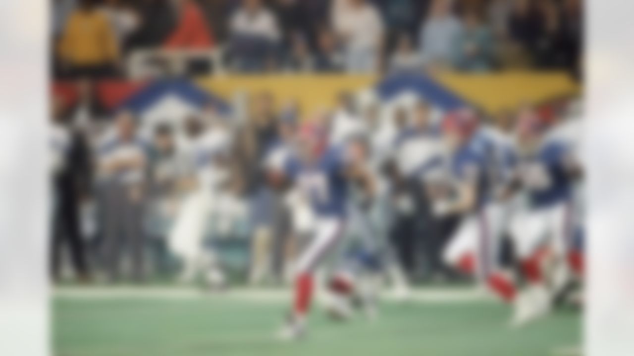 Buffalo Bills corner back Nate Odomes (37) runs back an intercepted pass from Dallas Cowboys quarterback Troy Aikman (not pictured) during second quarter action at Super Bowl XXVIII at Georgia Dome in Atlanta, Jan. 30, 1994. (AP Photo/John Gaps III)