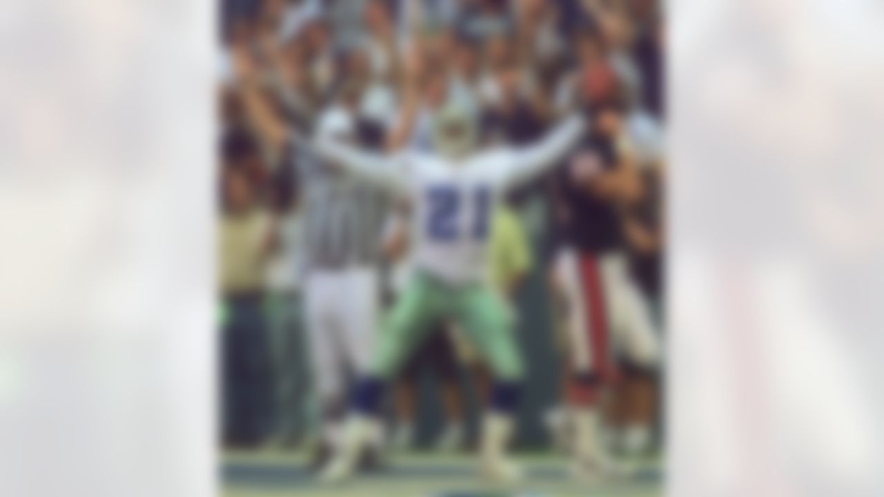 Dallas Cowboys punt returner Deion Sanders (21) celebrates his 83-yard punt return against the Chicago Bears in the third quarter Sunday, Sept. 28, 1997, in Irving, Texas. At right is Bears' Harper LeBel (88). (AP Photo/Eric Gay)