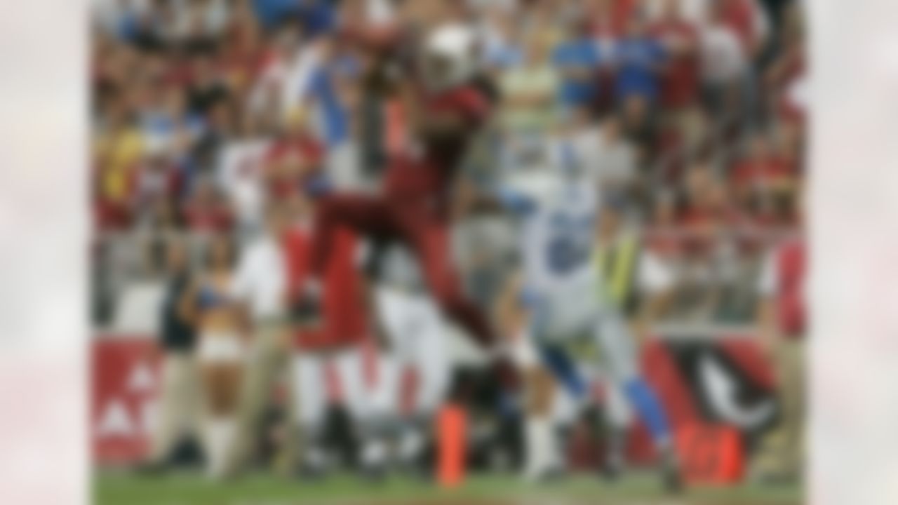 GLENDALE, AZ - NOVEMBER 11: Wide receiver Larry Fitzgerald #11 of the Arizona Cardinals catches a touchdown pass in front of Keith Smith #23 of the Detroit Lions in the second quarter at the University of Phoenix Stadium November 11, 2007 in Glendale, Arizona. (Photo by Jeff Gross/Getty Images)