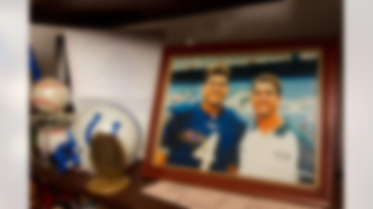 A photo of Jim Harbaugh, quarterback for the Baltimore Ravens, and John Harbaugh, assistant coach for the Philadelphia Eagles, is on display at their parents' home in Mequon, WI. (Todd Rosenberg/NFL)