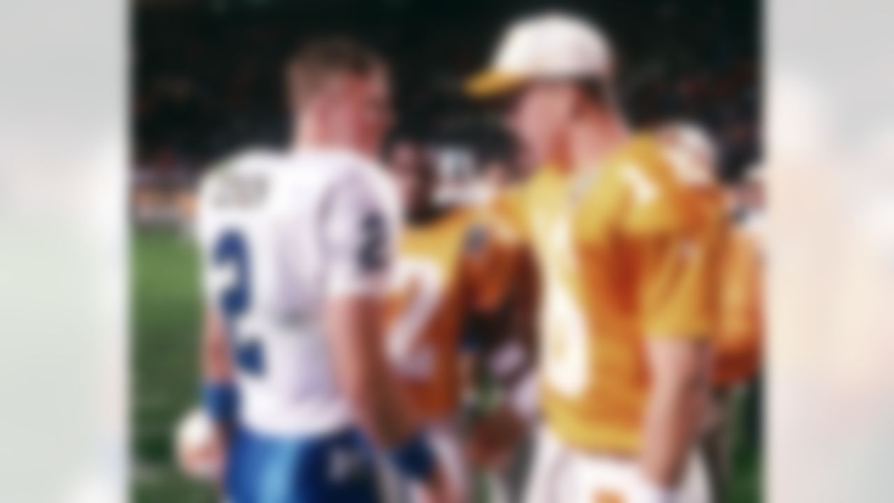 Tennessee quarterback Peyton Manning (16) talks with Kentucky's Tim Couch (2) after their game Nov. 23, 1996, in Knoxville, Tenn. The two big-time passers will meet again Saturday when Tennessee travels to Lexington to play Kentucky. (AP Photo/Wade Payne)