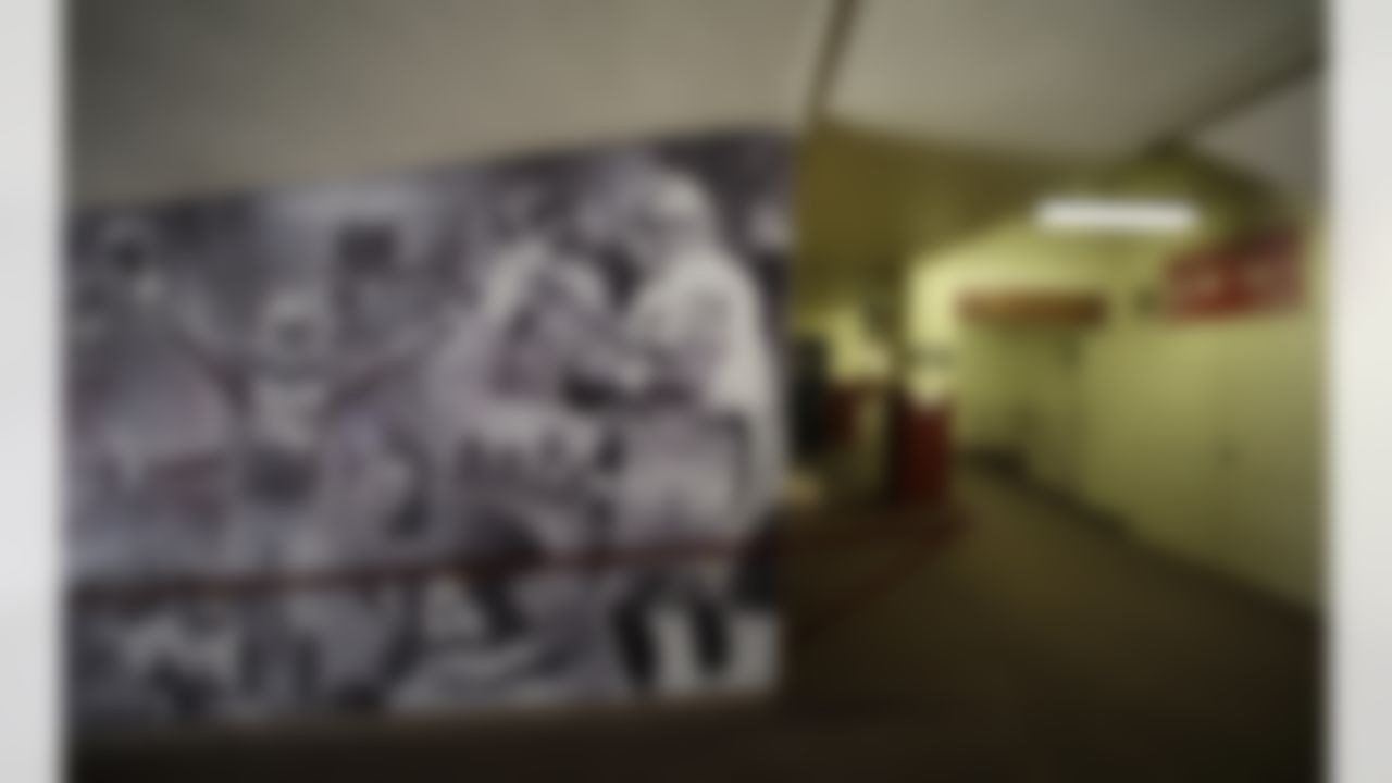 In this photo taken Tuesday, Dec. 17, 2013, a large showing San Francisco 49ers greats including Jerry Rice and Joe Montana is shown near a hallway leading to luxury boxes at Candlestick Park in San Francisco. The San Francisco 49ers are about to play their last NFL football game at the stadium they have called home since 1971. Candlestick Park was also the home of the San Francisco Giants from 1960-1999. (AP Photo/Eric Risberg)