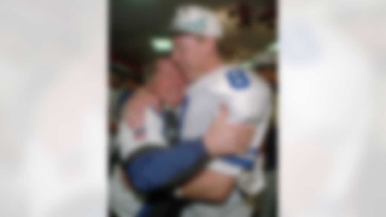 Dallas Cowboys head coach Jimmy Johnson, left, hugs quarterback Troy Aikman in their locker room after beating the Buffalo Bills 30-13 in Super Bowl XXVIII at Atlanta's Georgia Dome, in this Jan. 30, 1994 photo. (AP Photo/Charles Krupa)