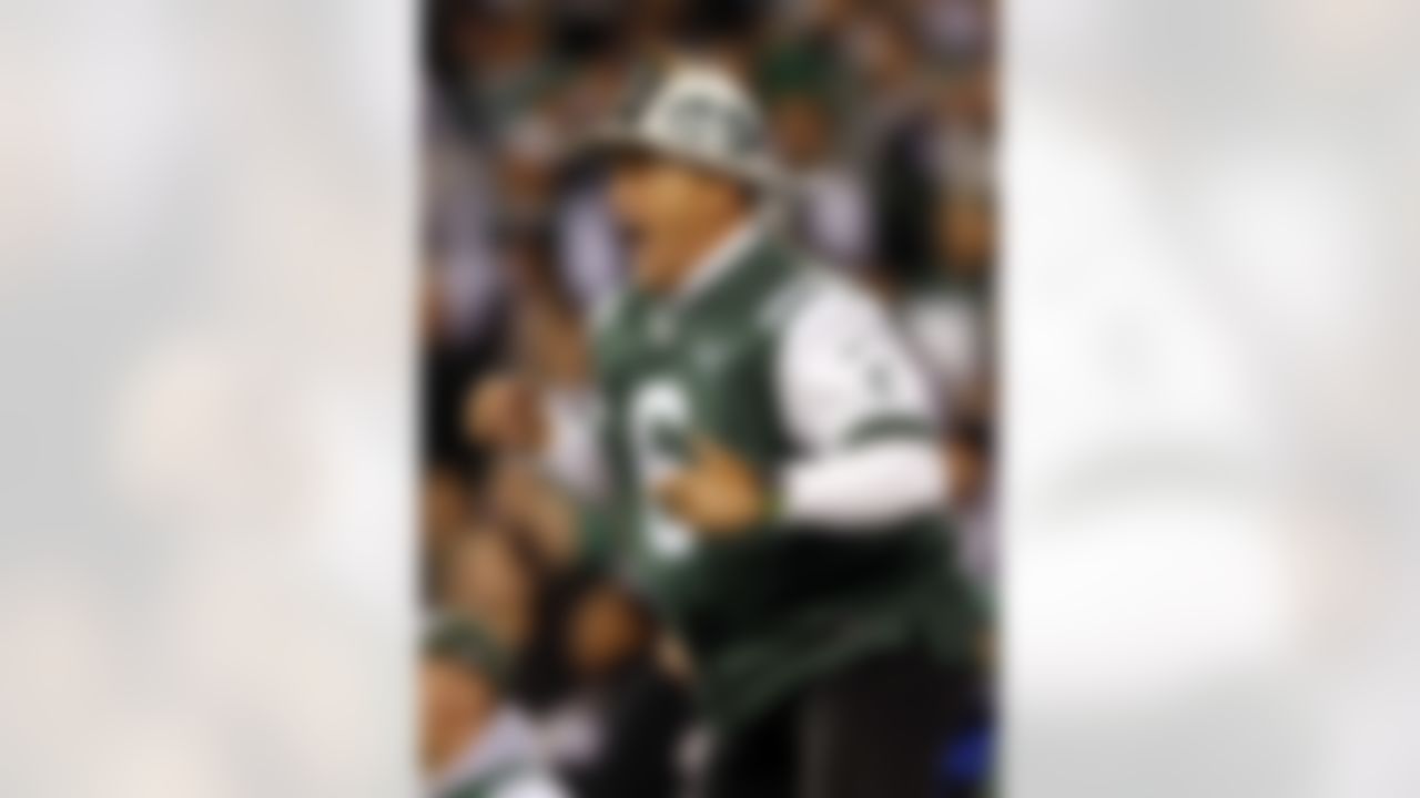 Edwin Anzalone, better known as Fireman Ed, leads a J-E-T-S cheer during the New York Jets NFL week 5 football game against the Houston Texans on Monday, Oct. 8, 2012 in East Rutherford, N.J. The Texans won the game 23-17. (AP Photo/Paul Spinelli)
