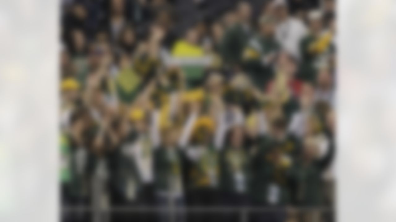 Green Bay Packers fans cheer before the NFL Super Bowl XLV football game between the Packers and Pittsburgh Steelers Sunday, Feb. 6, 2011, in Arlington, Texas. (AP Photo/Mark Humphrey)