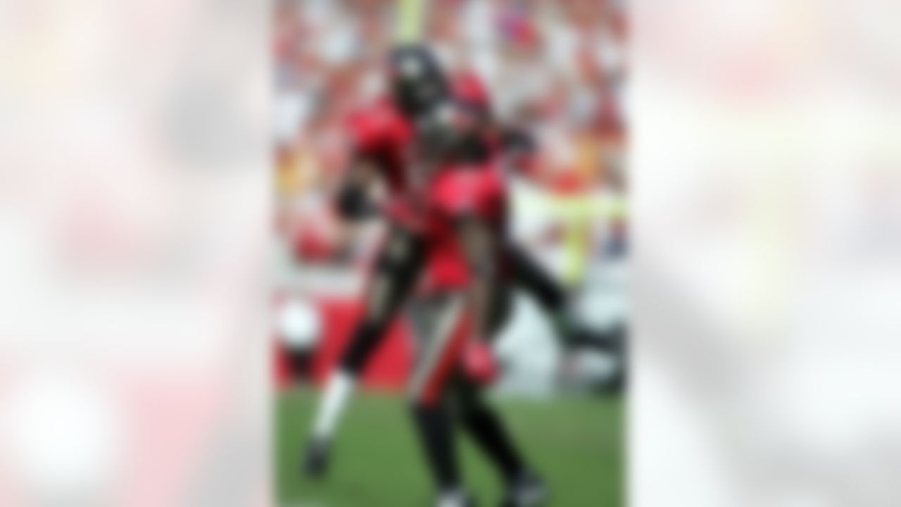TAMPA, FL - NOVEMBER 25: Defenders Greg White #91 and Jermaine Phillips of the Tampa Bay Buccaneers celebrate after a fumble against the Washington Redskins on November 25, 2007 at Raymond James Stadium in Tampa, Florida. (Photo by Marc Serota/Getty Images)