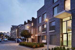 Row of houses on a street with street lights