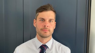 A photo of Tyrone looking at the camera