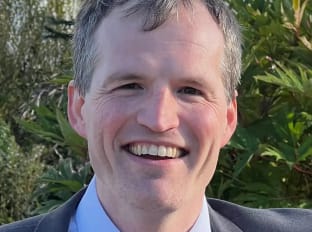 James Ardley smiling at the camera