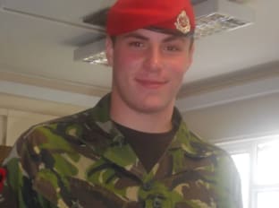James Starr in army uniform smiling at the camera