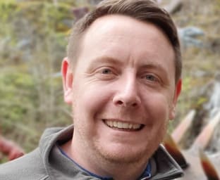 A picture of Ashley smiling at the camera