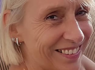  a blonde woman smiling at the camera