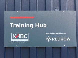 A photo of the sign outside nhbc's training hub