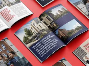 a photo of a housing association booklet on a red background