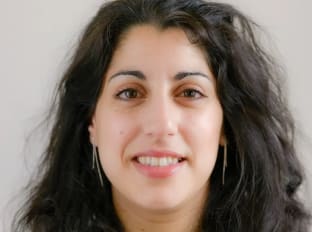 A woman smiling at the camera