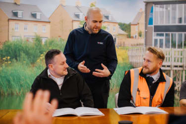 Male leading a training class in construction