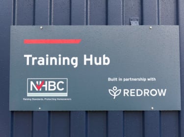A photo of the sign outside nhbc's training hub