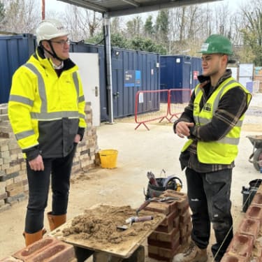 MP Ian Sollom talking to an apprentice at nhbc's cambridge training hub