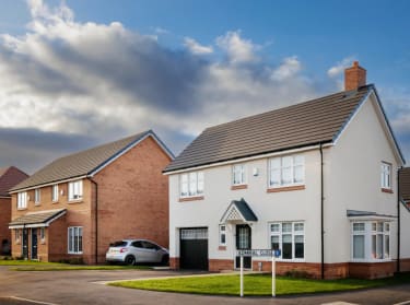 a photo of a white-fronted new build house at charlton gardens
