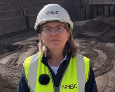 Carla Stephen in NHBC ppe on a brownfield site