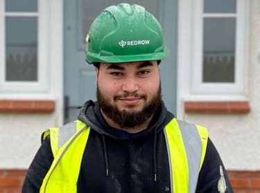 Redrow apprentice for NHBC in safety uniform