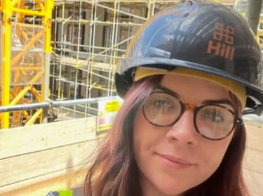 a photo of charlotte harrigan on site in site safety clothing