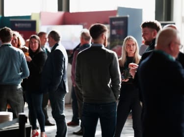 Groups of people socialising at an NHBC event