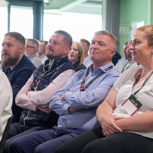 Best practice seminar with people watching speech
